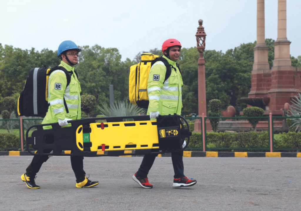 Rescue workers with spine board
